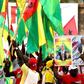 Activists of the African Party for the Independence of Guinea and Cape Verde (PAIGC) hold a picture of Guinea-Bissau's party leader Domingos Simoes Pereira during a rally in March 2019