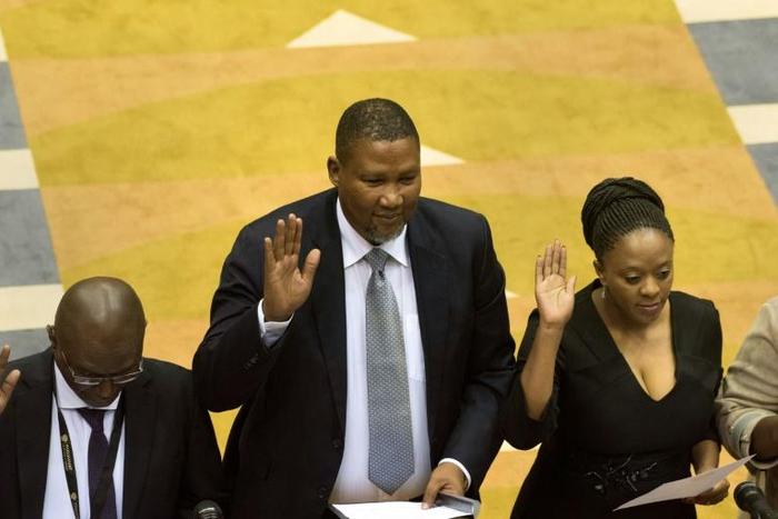 Oath of office: Mandla Mandela, centre, the grandson of Nelson Mandela, was sworn in alongside other newly-elected MPs