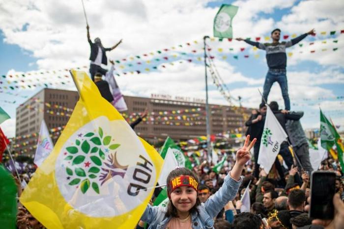 Supporters of Turkey's main pro-Kurdish People's Democratic Party (HDP) party cheer as they celebrate the Kurdish New Year during a campaign rally in Istanbul on March 24, 2019 ahead of the March 31 local elections