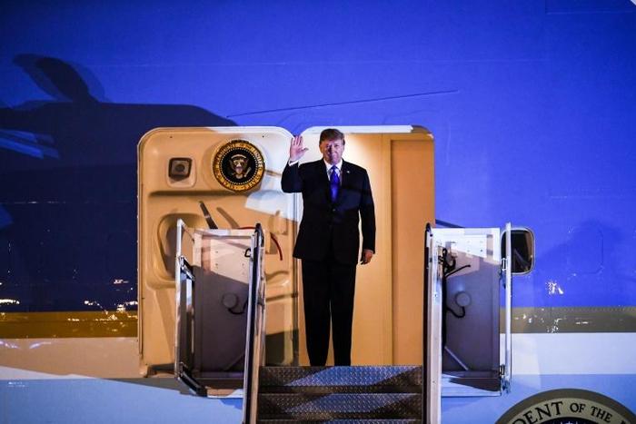 Donald Trump made no comment to reporters on Air Force One but had previously tweeted his hopes for a 'very productive' meeting in Hanoi