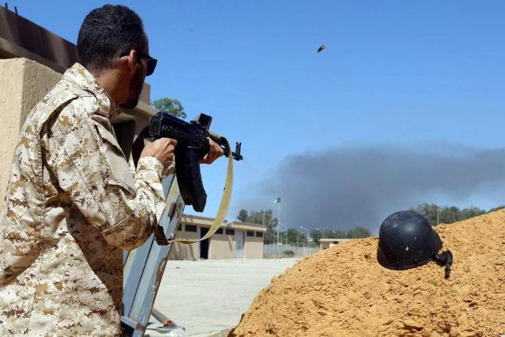 A fighter loyal to the internationally recognised government in Tripoli holds a position south of the capital as forces under commander Khalifa Haftar set their sights on taking the capital