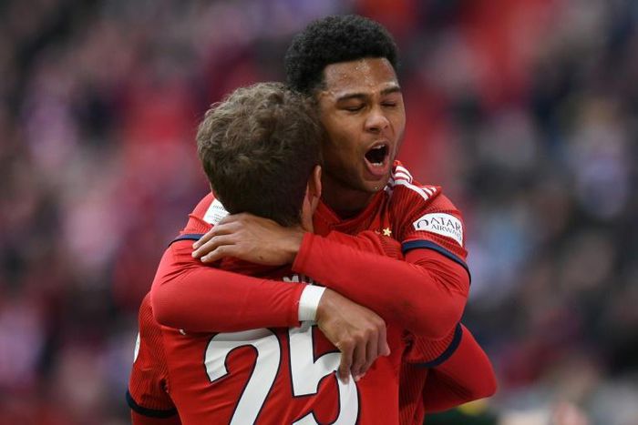 Bayern Munich forwards Thomas Mueller and Serge Gnabry celebrate