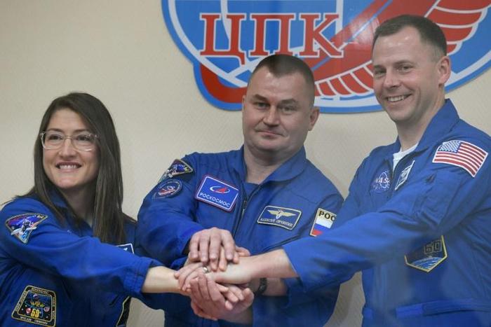 US astronauts Christina Koch and Nick Hague (R) and Russian cosmonaut Alexey Ovchinin are scheduled to travel to the International Space Station