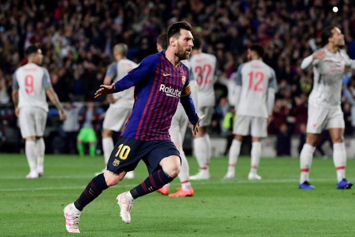 Barcelona's Lionel Messi celebrates after scoring his team's third goal against Liverpool