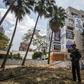 A police officer stands guard outside the Monaco building that was once the Medellin home of late drug baron Pablo Escobar