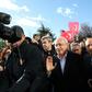 The chairman of the Republican People's Party (CHP) Kemal Kilicdaroglu (C) was assaulted by a mob at a soldier's funeral on Sunday