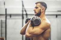 Strong man is doing cross training exercise