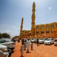 Sudanese worshippers arrive outside a mosque to attend the weekly Friday sermon and prayers during the holy month of Ramadan in the capital Khartoum