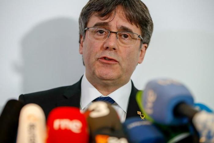 Former Catalan leader Carles Puigdemont says the trial of 12 ex-colleagues over a secession bid is a 'stress test' for Spain's democracy and judiciary