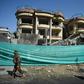 The massive explosion felled trees and toppled dense concrete blast walls on the street outside the Counterpart International compound in Kabul