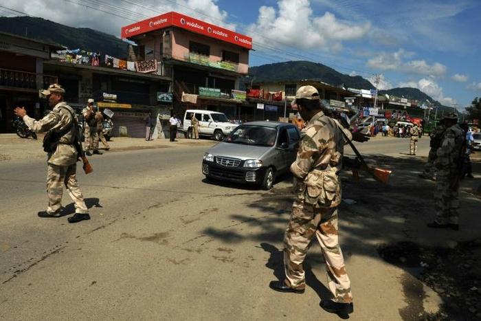 Indian paramilitary soldiers guard a security check post in Itanagar, capital of Arunachal Pradesh, northeast India on October 11, 2009