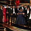 Producers accept the best picture Oscar for "Green Book," which has taken more than $140 million in box offices worldwide, but sparked controversy