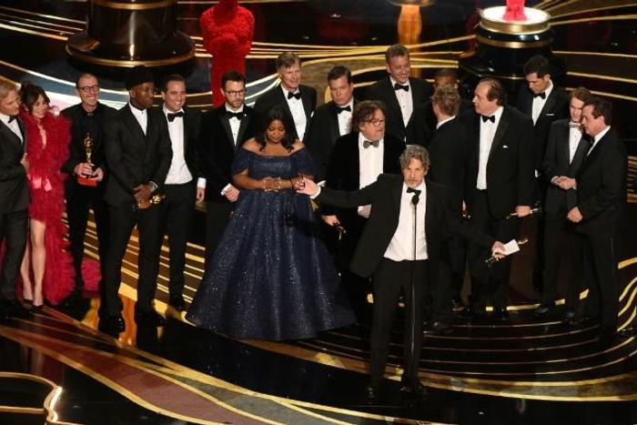 Producers accept the best picture Oscar for "Green Book," which has taken more than $140 million in box offices worldwide, but sparked controversy