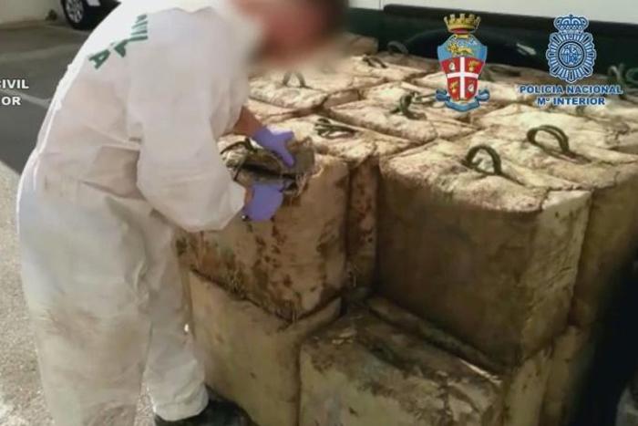 A video grab made available by the Spanish Guardia Civil showing packs of hashish seized during the raids