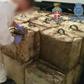A video grab made available by the Spanish Guardia Civil showing packs of hashish seized during the raids