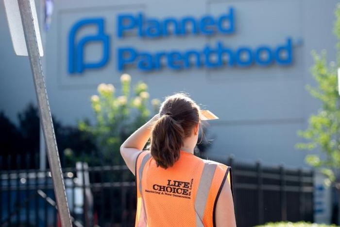 A Coalition For Life sidewalk counselor, an organization dedicated to ending abortions, stands outside of the Planned Parenthood Reproductive Health Services Center in St Louis, Missouri, May 31, 2019