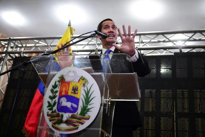 Venezuelan opposition leader and self-declared interim president Juan Guaido talks during a meeting with professionals and technicians at the Caraca's Chamber of Commerce Auditorium, in Caracas on May 16, 2019