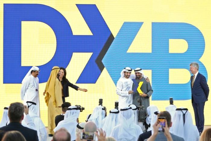 Ruler of Dubai Sheikh Mohammed bin Rashid Al-Maktoum (2-L), and the Emirate's Crown Prince Sheikh Hamdan bin Mohammed bin Rashid Al-Maktoum (3-R), participate in ceremony to present the new logo of Dubai International Airport on February 13, 2019