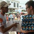 Giovanni Jose Plaza (L), a Venezuelan migrant suffering from AIDS, asks passersby in the border town of Cucuta, Colombia for money to buy medications