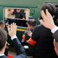 Kim Jong Un (C) has made the trip to Beijing several times in his personal train