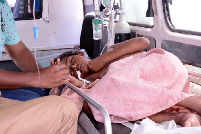 A woman injured in the St Sebastian Church blast is taken to hospital