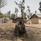 A vigilante clutches his weapon in the village of Bakin Kogi, in Kaduna state, northwest Nigeria -- a region that has long been a centre of unrest fuelled by ethnic and religious tensions