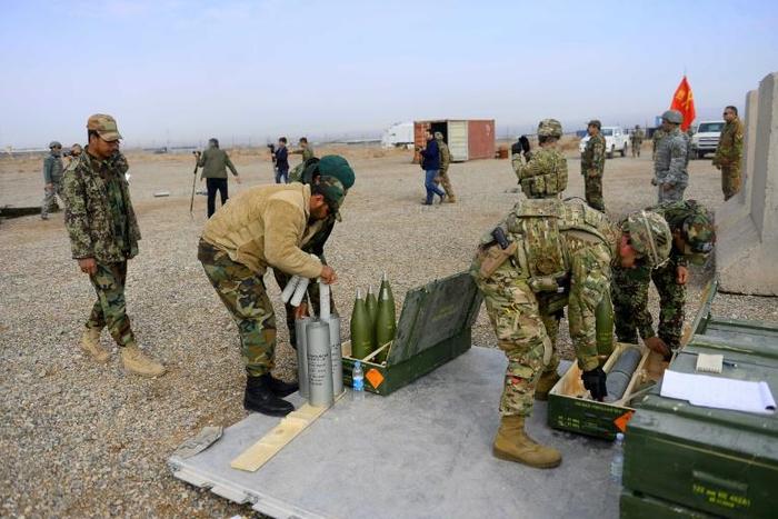 US, Italian and Afghan troops prepare shells during a February 2019 training exercise in Afghanistan's Herat province