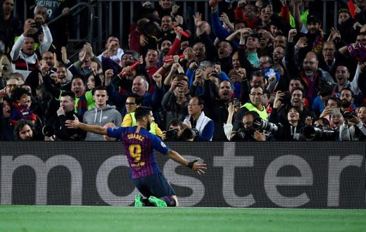 Luis Suarez celebrates scoring Barcelona's first goal against Liverpool on Wednesday.