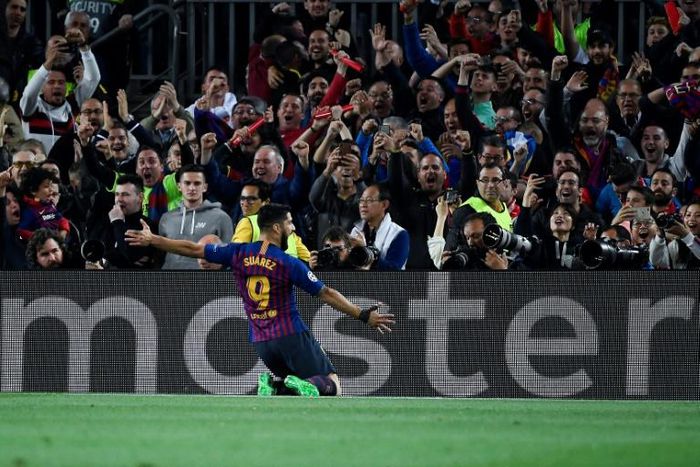 Luis Suarez celebrates scoring Barcelona's first goal against Liverpool on Wednesday.