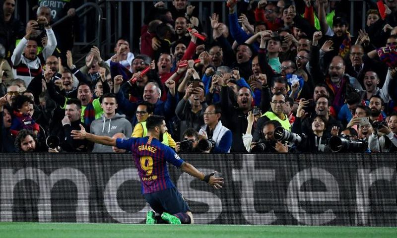 Luis Suarez celebrates scoring Barcelona's first goal against Liverpool on Wednesday.