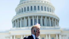 Donald Trump signed an order prohibiting purchase of equipment from companies that pose 'an unacceptable risk to the national security'