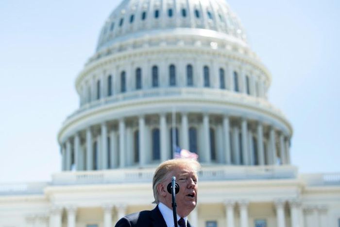 Donald Trump signed an order prohibiting purchase of equipment from companies that pose 'an unacceptable risk to the national security'