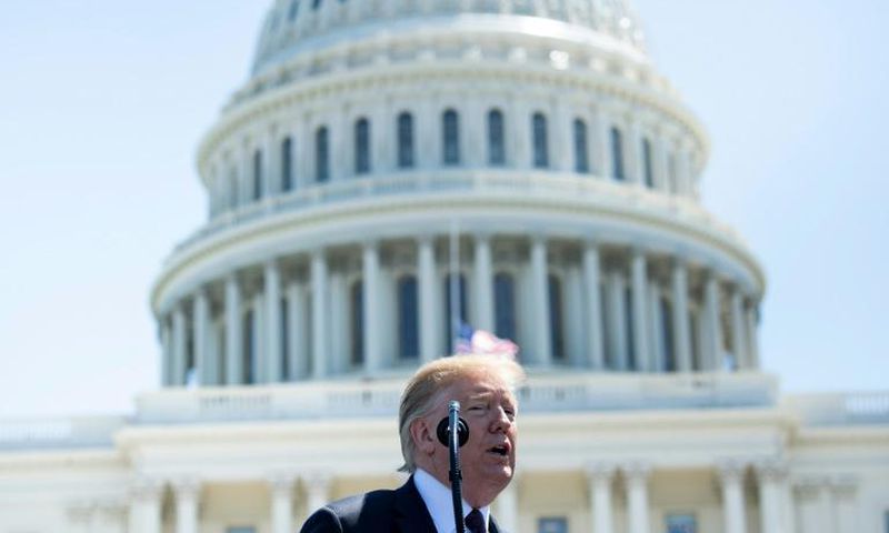 Donald Trump signed an order prohibiting purchase of equipment from companies that pose 'an unacceptable risk to the national security'