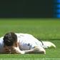 Valencia's Santi Mina lies on the field during their 1-0 defeat to Eibar on Sunday