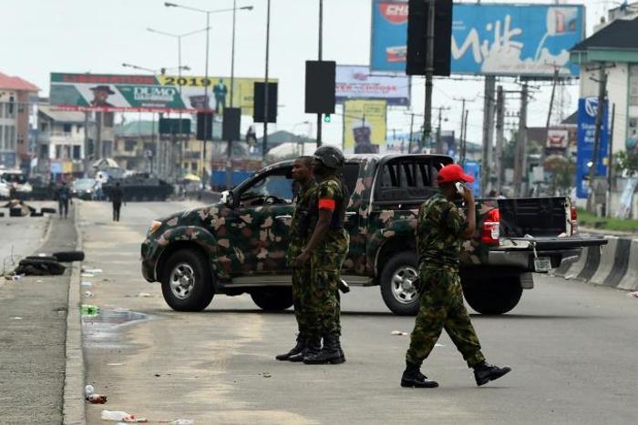 International observers expressed concern after men in military uniform surrounded a vote counting centre in the capital of southern Rivers State