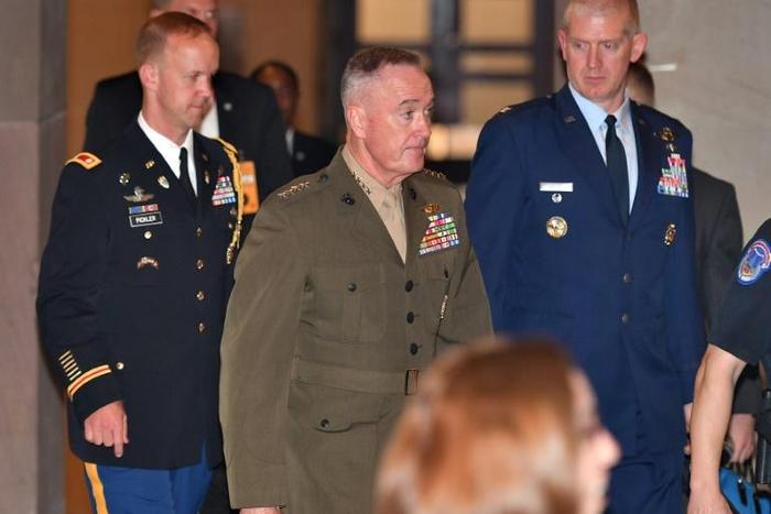 Joint Chiefs of Staff Chairman General Joseph Dunford (C) says "collective action" is needed to counter China's militarization of the South China Sea