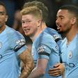 Kevin De Bruyne (centre) celebrates scoring Manchester City's opening goal against Cardiff