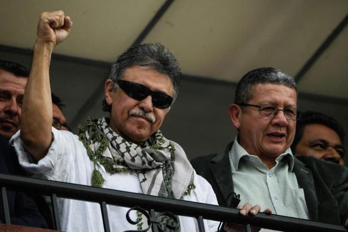 Former FARC commander Jesus Santrich (L) greets supporters after the Supreme Court ordered his release in Bogota, Colombia on May 30, 2019
