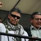 Former FARC commander Jesus Santrich (L) greets supporters after the Supreme Court ordered his release in Bogota, Colombia on May 30, 2019