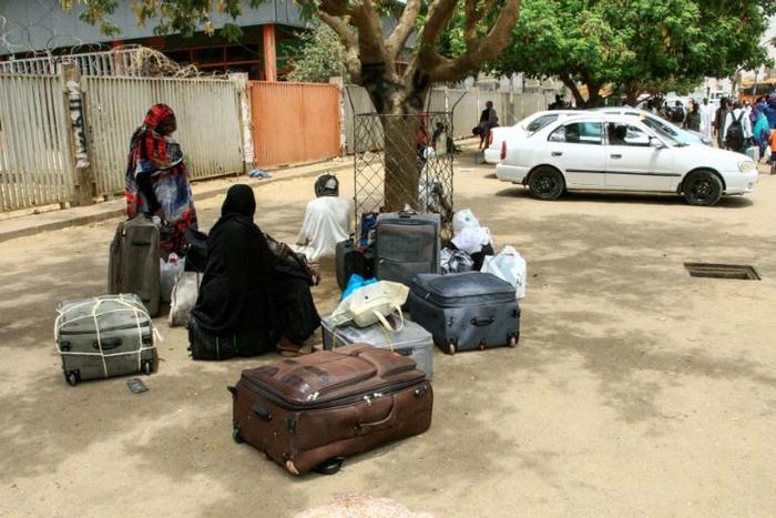 Stranded passengers wait at Khartoum's main bus terminal where drivers and other staff overwhelmingly observed a strike called by protest leaders to raise the pressure on Sudan's ruling generals to step down