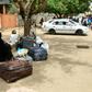 Stranded passengers wait at Khartoum's main bus terminal where drivers and other staff overwhelmingly observed a strike called by protest leaders to raise the pressure on Sudan's ruling generals to step down