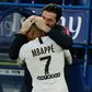 Kylian Mbappe celebrates with Gianluigi Buffon after scoring PSG's winner at Caen on Saturday