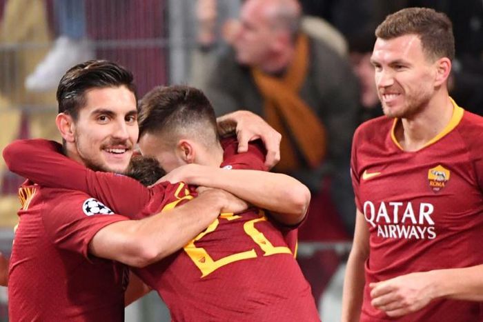 Lorenzo Pellegrini (L) and Edin Dzeko (R) fired in two quickfire goals for Roma