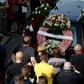 Relatives and friends march behind the funeral cortege of former Spanish football player Jose Antonio Reyes