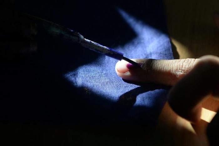 The index finger of every Indian voter is marked with indelible ink after they cast ballots, to make sure they do not vote again