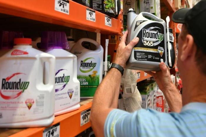 In this file photo taken on July 9, 2018, Customer Gary Harms shops for Roundup products at a store in San Rafael, California