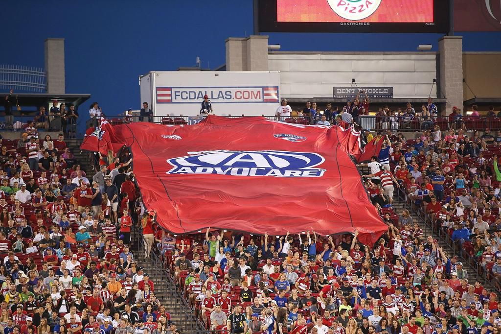 FC Dallas fans spread out a large Advocare banner at Toyota Stadium on April 12, 2014 in Frisco, Texas.