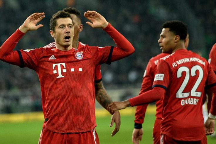 Poland striker Robert Lewandowski celebrates scoring his 194th Bundesliga goal on Saturday