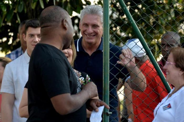 Cuban President Miguel Diaz-Canel and his wife Lis Cuesta queue to vote for the new Cuban constitution in Havana