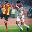 Ghailene Chaalali (L) of Esperance Tunis holds off Walid el Karti of Wydad Casablanca during the first leg of the 2019 CAF Champions League final in Rabat